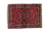 Vintage Lilihan rug mat with cherry red field, floral medallion, and colorful bouquets, 2'1