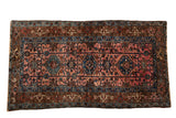 Vintage Lilihan rug in dusty rose with sapphire blue medallions and serrated palmettes.