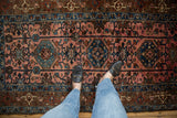 Vintage Lilihan rug featuring dusty rose, sapphire palmettes and varied pile height.