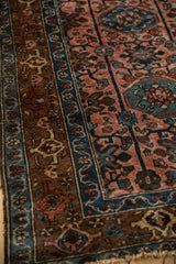 Fine Vintage Lilihan Rug close-up, sapphire blue border, bronze stylized motifs, and varied pile.
