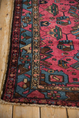 Vintage Mehreban rug with raspberry red field, sapphire border, and geometric vinery.