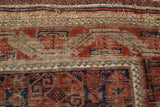 Antique Belouch rug runner detail, geometric madder red and navy patterns, exposed foundation, and tatter.