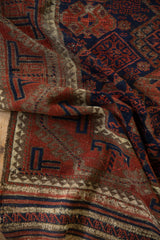 Antique Belouch rug runner's original flatwoven end; striped navy, red, beige with tatter.