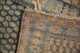 Vintage Hamadan rug edge displaying hand-knotted back weave and worn madder root red border.