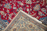 Detail of the finely woven corner, selvage, and fringe on a vintage Persian Nain carpet.