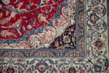 Finely woven corner spandrel of a Nain rug with dragon and in-flight bird motifs.