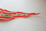 Vintage felt pennant featuring 'LIBERTY ISLAND' text and tapering red stripes.