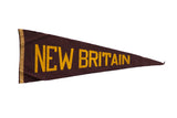 Vintage New Britain felt pennant flag in faded brown with yellow text, 11x29 inches.