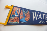 Angled view of the Watkins Glen felt flag showing waterfall graphics and yellow ties.