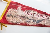Detailed illustrated map of the Gettysburg Battlefield on a vintage red felt flag.