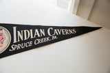 Black felt pennant detail with white 'Indian Caverns Spruce Creek, PA' text and creasing.