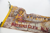 Contoured vintage felt flag showing Native American canoe scene, gold, maroon, and cream tones.