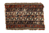 Antique Anatolian rug fragment with unusual running water motifs in red, blue, and brown channels.