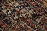 Folded corner of an antique Anatolian rug showing the weave's texture and storied, worn foundation.