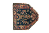 Antique Northwest Persian chairback rug featuring a peaked contour, deep teal field, and red geometric border.