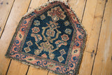 The unusual high-peak contour of a collectible Northwest Persian rug in deep teal and red.