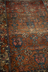 Vintage Mehreban rug: madder red field, blue floral vases, and knot head texture.