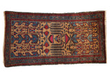 Vintage Mehreban rug with unusual weeping willow and plant motifs in blue and red over a golden field.