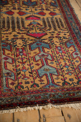 Angled view showing the stylized weeping willow and pomegranate motifs on a vintage Mehreban rug.
