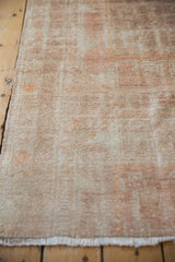 Distressed texture of a vintage Turkish Oushak rug showing even wear to the knot heads.