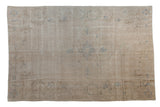 Distressed Oushak carpet in antique ivory, beige, and faint slate blue medallion design, 6' x 9'2