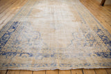 Distressed vintage Oushak rug showing foundation, abrash, and cobalt blue border.
