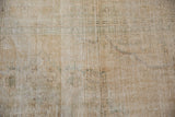 Distressed hand-knotted pile of a vintage Oushak with visible knot heads and foundation.