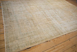 Angled view of the distressed Oushak rug's low pile, showing textured time-softened wear.
