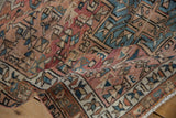 Evenly worn pile texture of vintage Karaja rug, geometric motifs in dusty rose and blue.