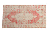 Vintage Distressed Oushak rug, dusty raspberry red and antique ivory, with floral medallion and textured wear.