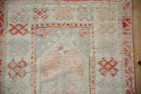 Vintage Distressed Oushak rug pile, featuring ivory, sea foam, and burnt orange tones.