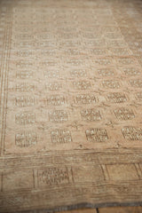 Soft, distressed pile of a Bokhara rug, with muted copper gul and diamond patterns.