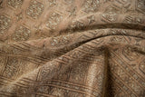 Softened texture on vintage distressed Afghani Bokhara rug with elephant footprint gul design.