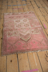 Storied texture of vintage Daulatabad rug, featuring elephant foot print motifs and fringe.