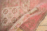 Distressed Daulatabad rug pile with worn knot heads, pink, camel hues, and fringe.