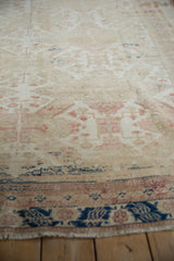 Distressed pile of the vintage Kayseri rug, showing cream, rose, and subtle navy abrash.