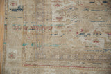 Distressed vintage Kayseri carpet texture, showing heavy abrashes and faded floral motifs.
