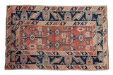 Vintage Distressed Melas rug, heavily abrashed cherry red field, navy geometric hook and latch motifs, 4'3