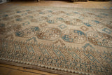Vintage distressed Ersari rug border, geometric blue and brown checkered design.
