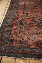 Vintage Hamadan rug's lustrous pile featuring red and blue serrated leaves, blossoms, and border.