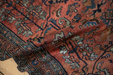 Vintage Persian Hamadan rug's patterned border and field in cochineal red, sapphire, and navy.