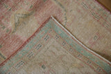 Close-up of the rug's reverse, showing the hand-knotted construction and secure side cord selvage.