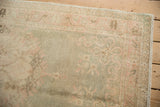 Vintage Distressed Oushak runner pile with subtle faded pale rose and sea foam green patterns.