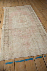 Distressed Oushak rug runner, with soft pink and beige pile and secured fringe.