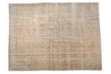 Vintage distressed Oushak carpet with a faded medallion in soft sandalwood and sea foam green.