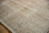 Textured low pile and visible knot heads on a distressed vintage Oushak carpet.