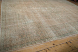 Low angle view showing the distressed, hand-knotted texture of the vintage Oushak carpet.