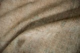 Close-up showing the hand-knotted foundation on the reverse of a vintage Oushak carpet.