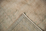 The hand knotted back and secured side edge of a vintage distressed Oushak carpet.
