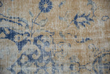 Distressed Oushak pile with worn pale dusty gold and cobalt blue palmette blossoms.